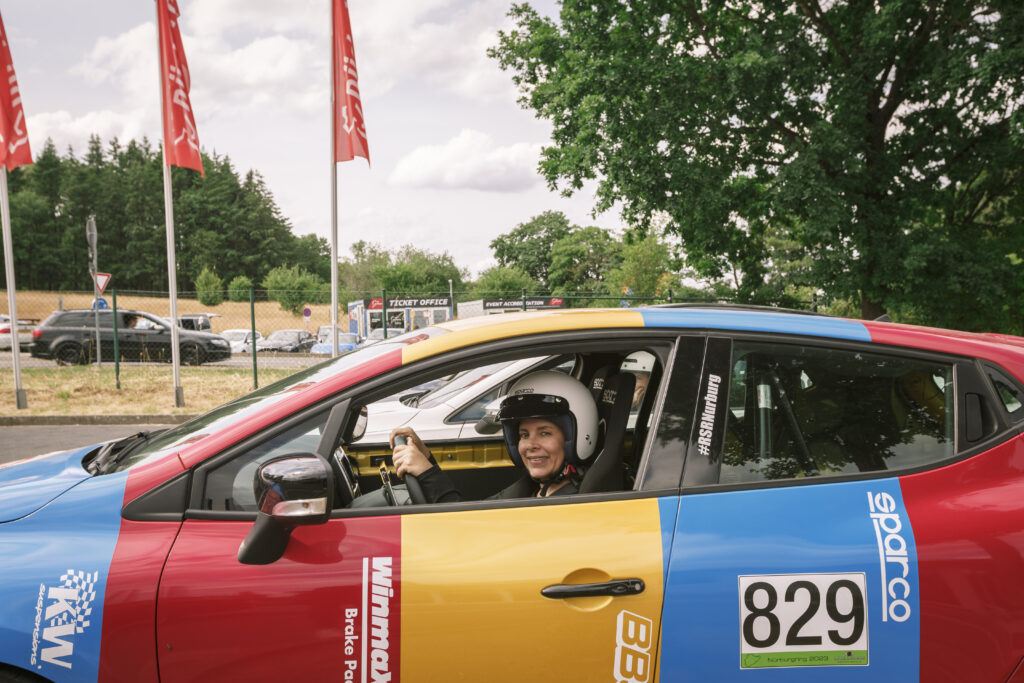 A woman in a car for a private track day at the Nurburgring.